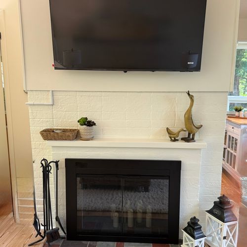 LIVING ROOM:  The large television and fireplace.  (The fireplace has electric candles in it that can be turned on, but it is not permitted to have a fire in the fireplace.)
