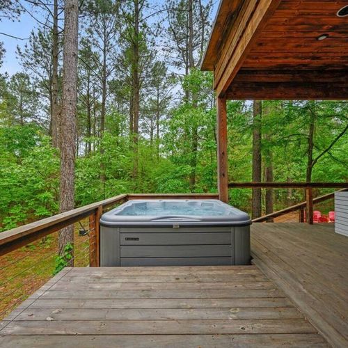 The hot tub sits behind the couch so that you don't miss a moment.