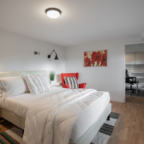 Downstairs guest bedroom ensuite opens to the laundry room and work area.