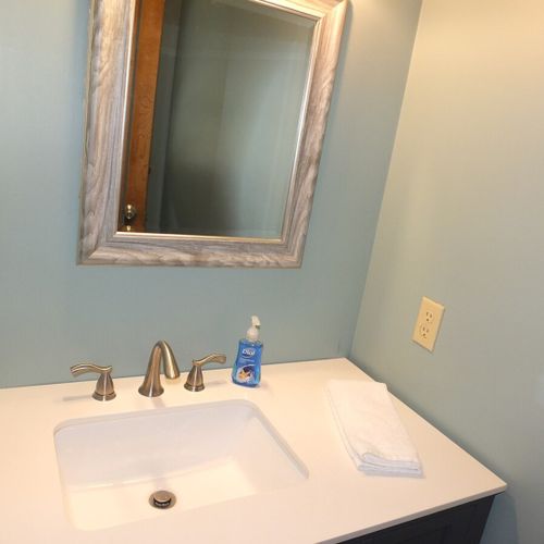 Bathroom #2:  half-bath a wink, mirror, and toilet.