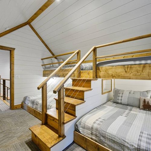 The bunk room featuring 2 Twin XL over King bunks.