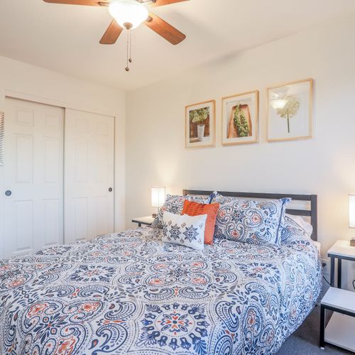 Queen bed wrapped in fresh, soft linens.