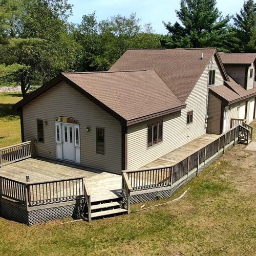 Overall:  a good aerial photo highlighting the privacy of the property and the large deck