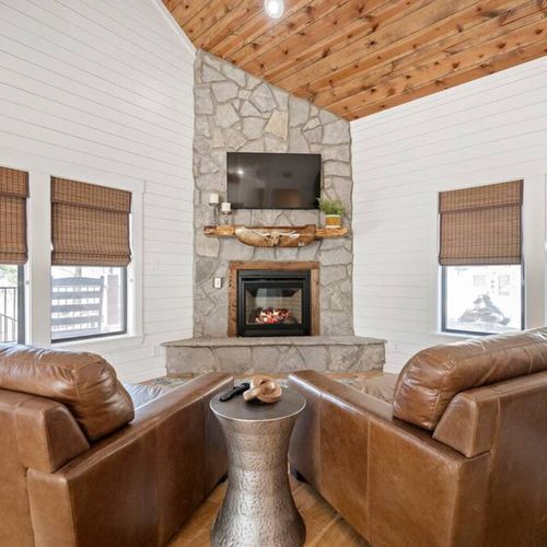 Luxury seating around a floor to ceiling fire place!