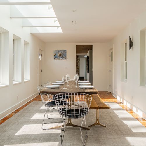 Gazing from the dining room back towards the kitchen, living room and foyer.