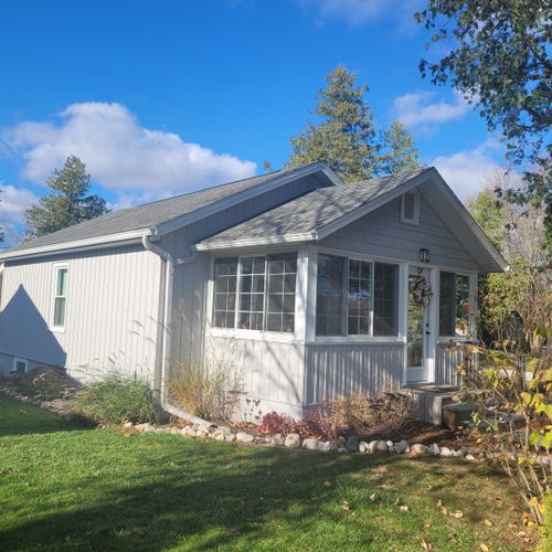 Exterior:  the front and side of the cottage in the fall.