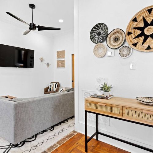 Airy staircase landing w/ curated wall decor — a stylish moment between floors.