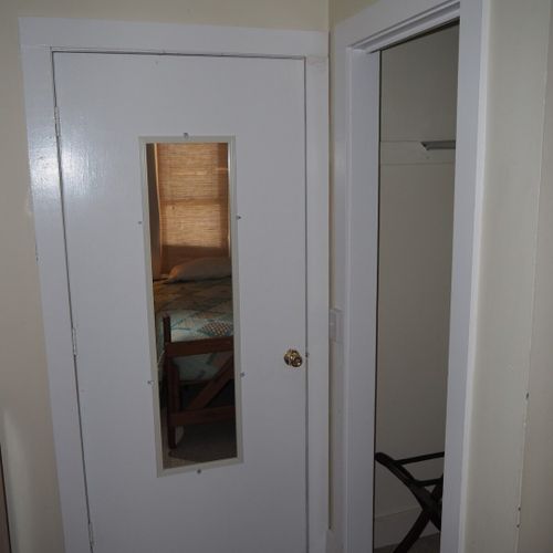 Bedroom #2:  features two twin beds, a nightstand, lamp, dresser, mirror, and closet.