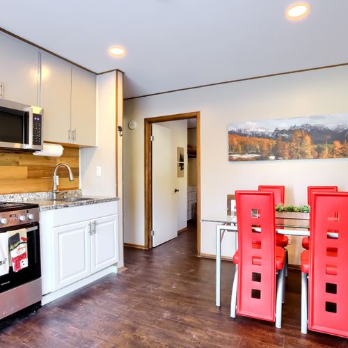 Experience the convenience of a fully equipped kitchen and shared outdoor bbq nearby.