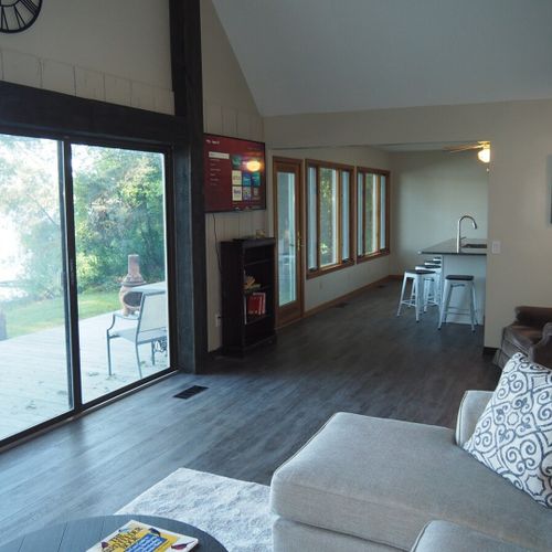Overview:  the living room features great natural lighting and gorgeous views of bass lake!