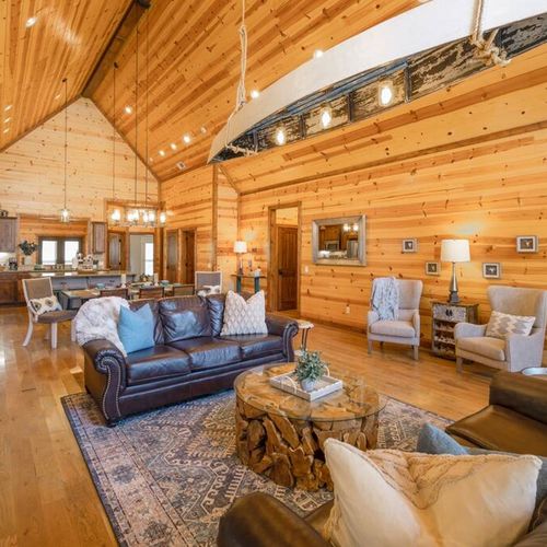 Additional lounge chairs in the living room and  canoe chandelier!