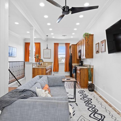 Bright open living area flows into the kitchen — a welcoming first look at the whole space.