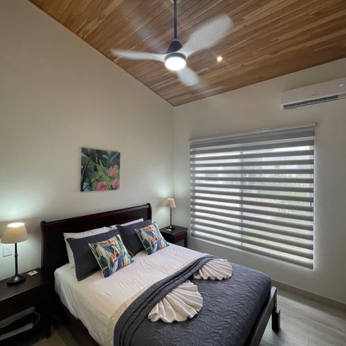 Beautiful bedroom #2 with a queen bed, AC and ceiling fan.