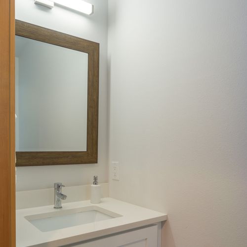 Powder room with fresh towels and soap are provided for your comfort on the main level of the house.