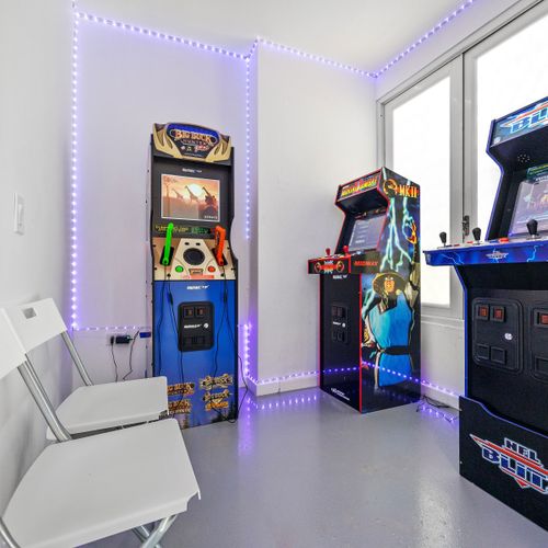 Game on! Relive the glory days in our retro arcade room, featuring classic games and vibrant neon lights for endless entertainment.