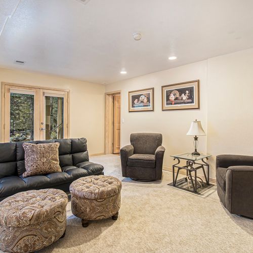 Lounge with warm touches and natural light throughout.