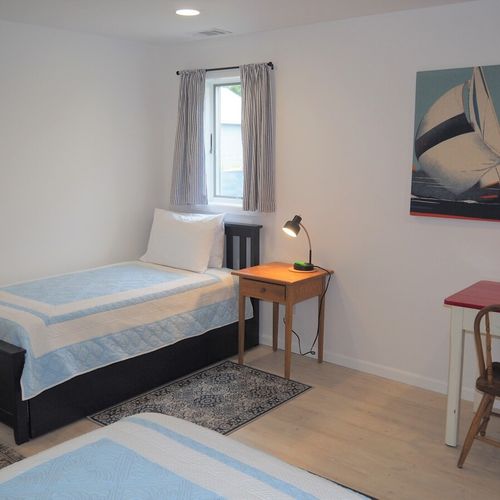 Lower level:   the large lower level basically functions as a third bedroom with 4 single beds via 2 trundle beds (i. E. 2 of the single beds roll up under the other 2 single beds). There is also a desk, two closets, two dressers, and third bathroom.