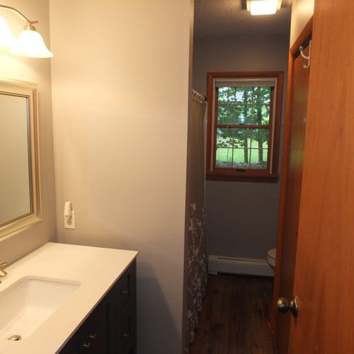 Bathroom #1:  full bathroom with a combination tub and shower.