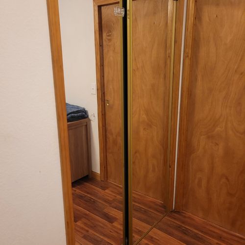 Bedroom #2:  the bedroom's mirror which is the door to the closet