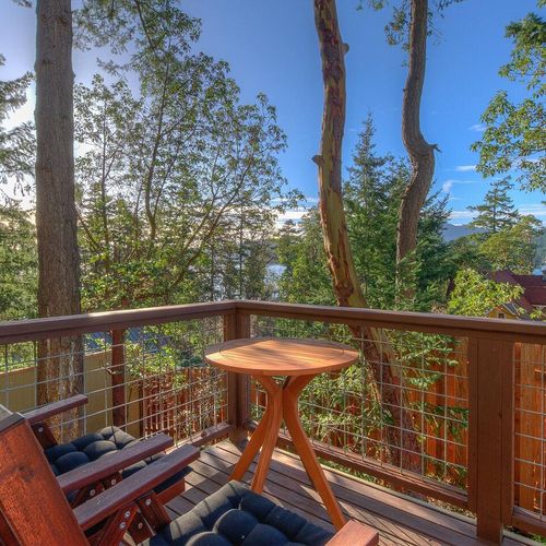 Back deck with bistro table and waterviews.