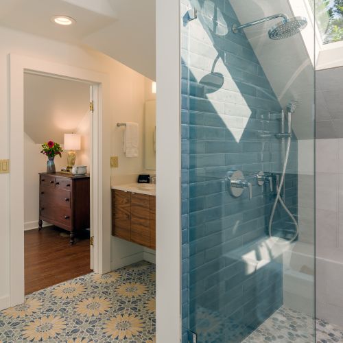 There is nothing vintage about the upstairs custom-tiled walk-in shower with skylights. Bright, contemporary with a rain showerhead and wand.