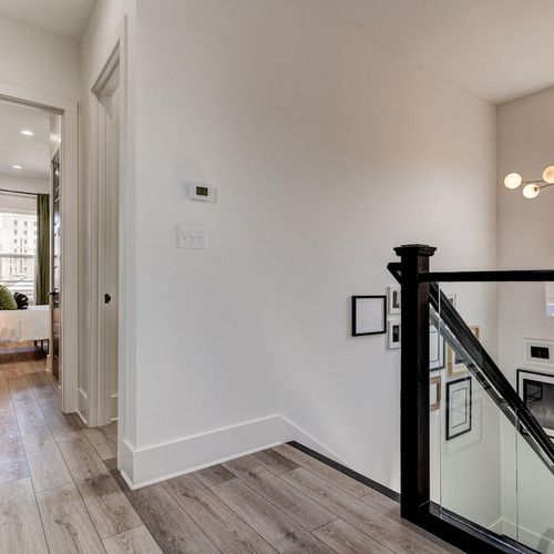 Staircase leading up to the rear bedroom & more living space.