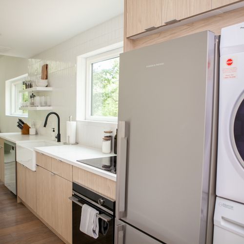 Kitchen interior with washer and dryer.