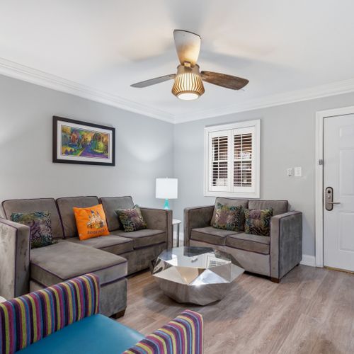 Kick back in the living room w/ cozy sofas & warm accent pillows.