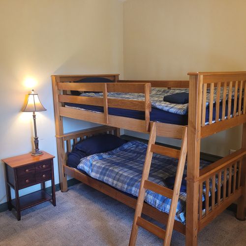 Bedroom #3 (lower level):  includes a twin-on-twin bunk bed, dresser, closet, nightstand, and lamps