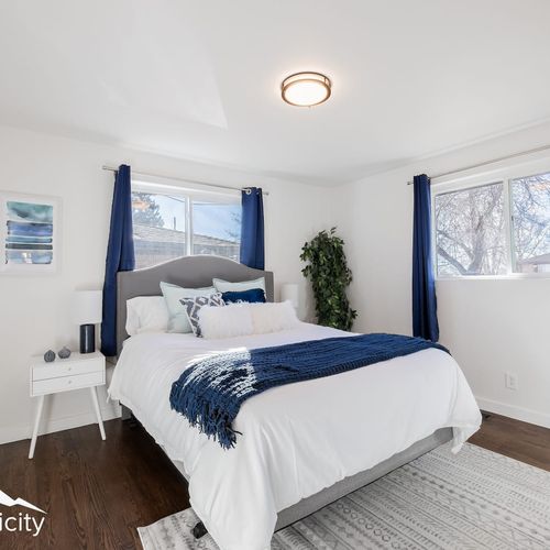 The sunlit and airy master bedroom includes an en suite bathroom for your convenience.