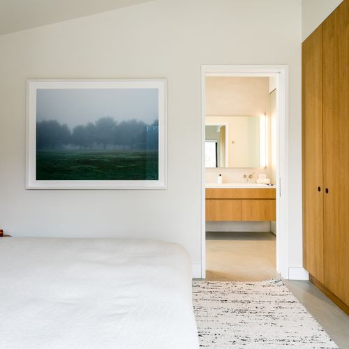 The primary bedroom features an ensuite bath and direct access onto the patio.