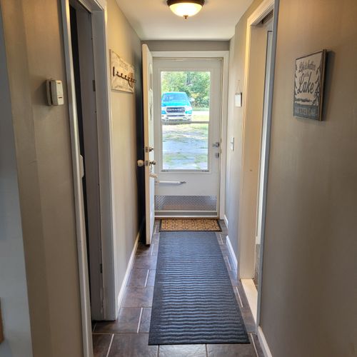 Hallway:  front hallway. The bedroom is to the left of the hallway in the photo.