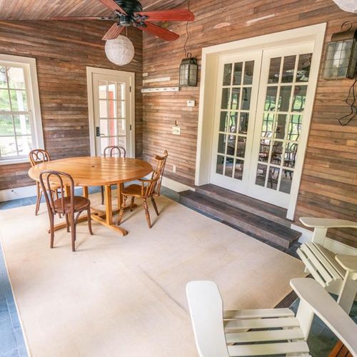 Sunroom connected to kitchen, dining room and back patio.