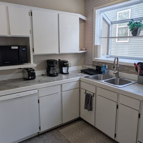 KITCHEN:  Recently updated kitchen with all appliances including a dishwasher and a good supply of cooking and dining utensils.