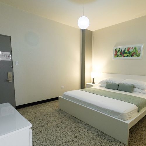 Step into your tranquil sanctuary. This clean and comfortable bedroom provides the perfect space to unwind and recharge after a day of adventures.
