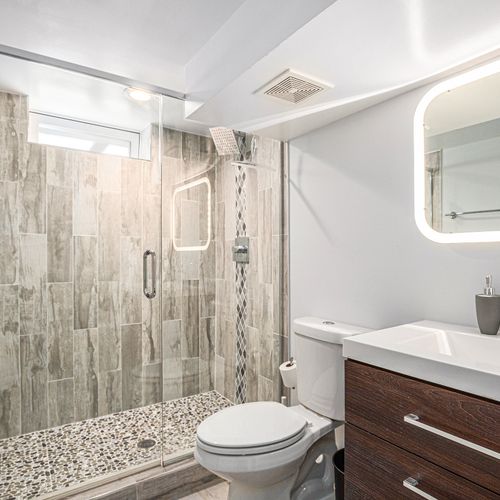 Luxurious bathroom with walk-in shower and elegant details.