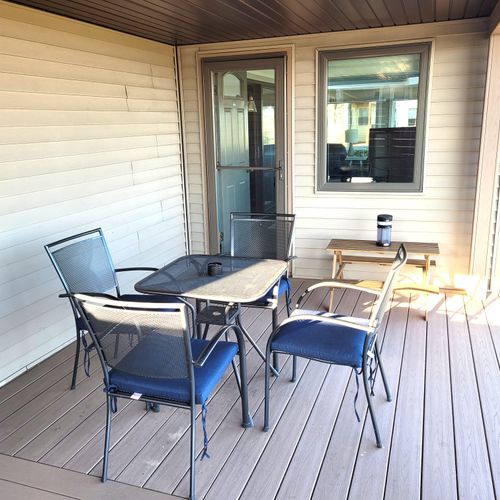 OVERVIEW:  The dining furniture on the backyard patio that faces Lake Huron