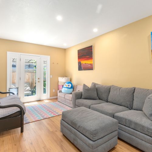 Relax and recharge in this airy, inviting living room with smart tv.
