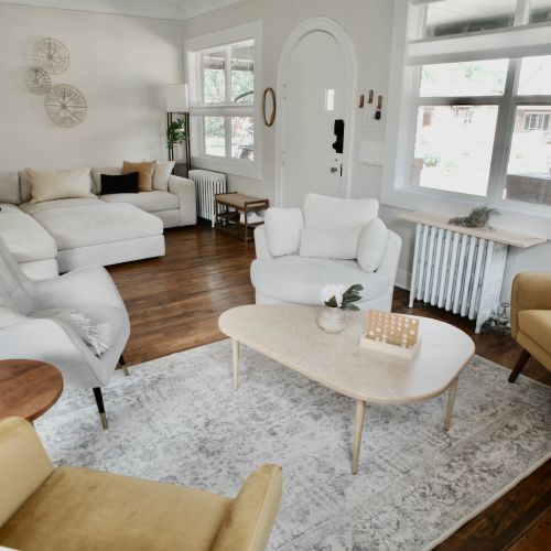 Bright living room with soft white tones.