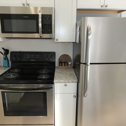 Kitchen:  a close-up of all of the appliances, including the stainless steel refrigerator.