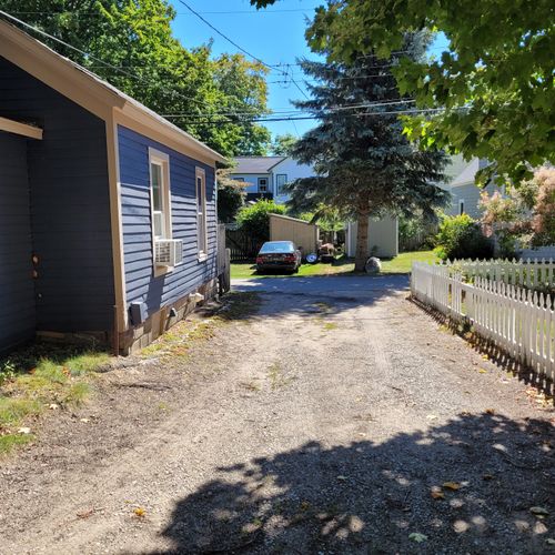 Exterior:  the driveway and side of the house.