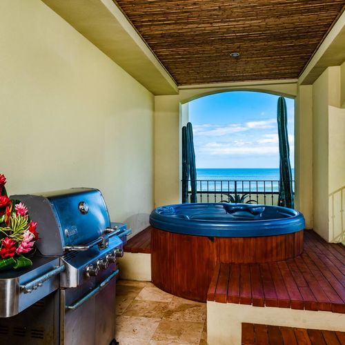 Grill on your balcony overlooking the ocean.