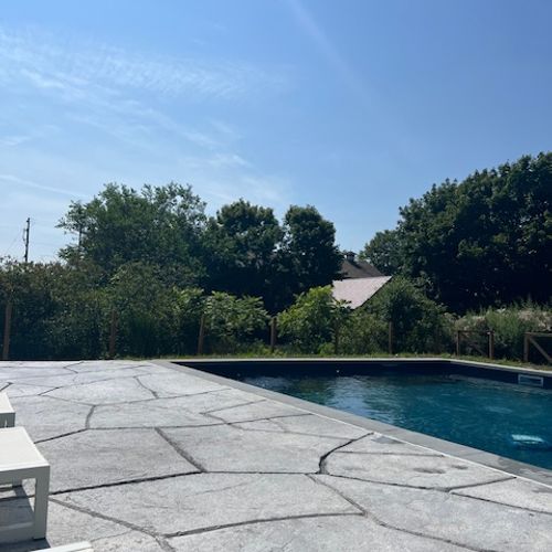 This gorgeous pool and patio is the perfect place to relax under the open sky