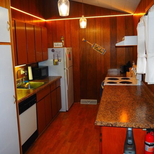 Kitchen:  very convenient and functional galley kitchen with all appliances, including a dishwasher. Includes lots of counter space and a good supply of cooking and dining utensils.