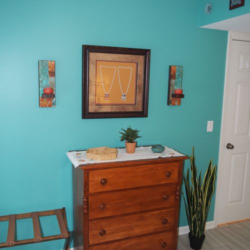 Bedroom:  very comfortable bedroom with a queen-size bed, ceiling fan, dresser, and mirror.