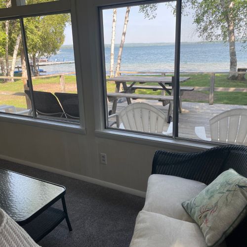 Porch:  the cottage has a beautiful enclosed porch with comfy seating and great views of the lake!
