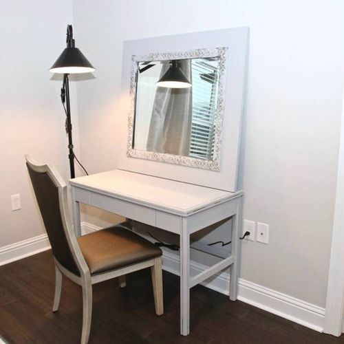 Dedicated workspace w/ a desk & mirror — ideal for remote work.