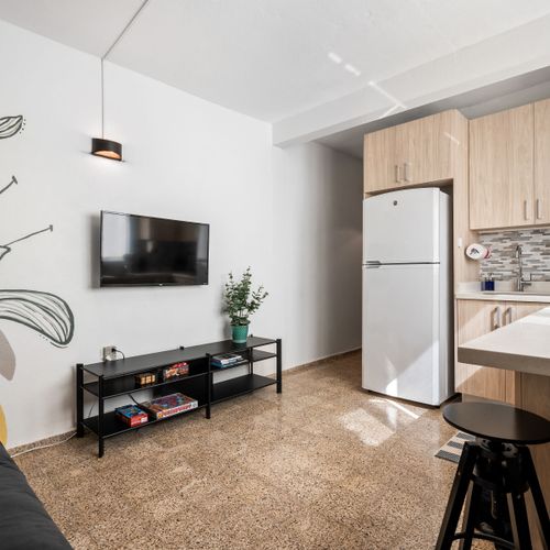 Bright & Functional: This kitchen boasts a clean design with plenty of storage and light, making it a joy to use. The efficient layout ensures everything you need is at your fingertips.