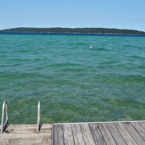 Exterior:  gorgeous crystal lake, the stairs from the dock down into the water, and the mooring buoy for boats out in the lake.