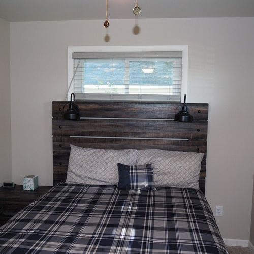Bedroom #1:  features a queen-size bed, ceiling fan, and closet.